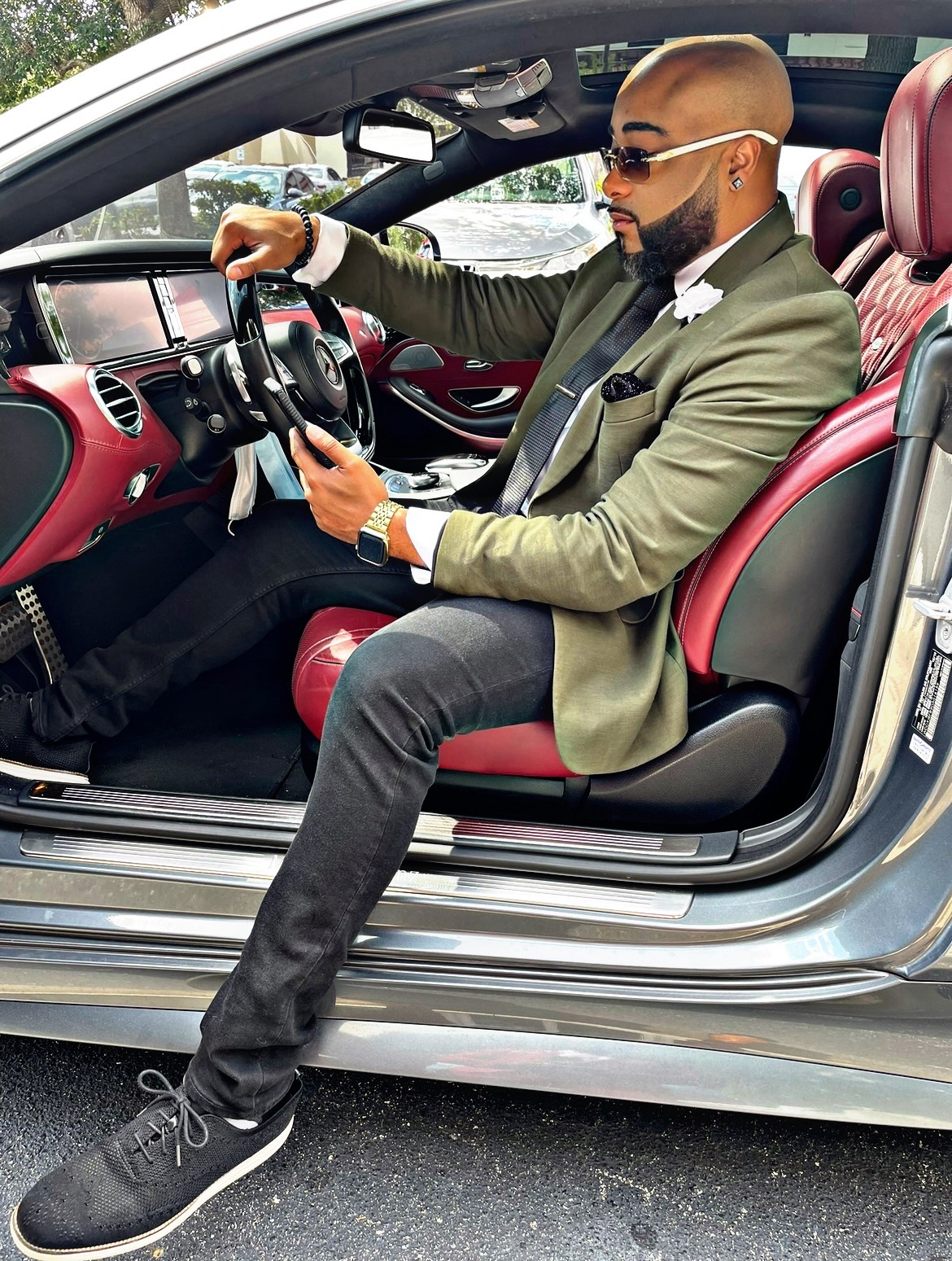 Brandon Anthony seated in his car, ready to take your call